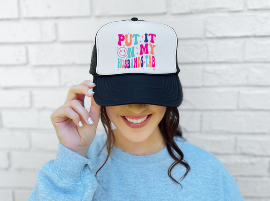 Put It On My Husbands Tab Trucker Hat